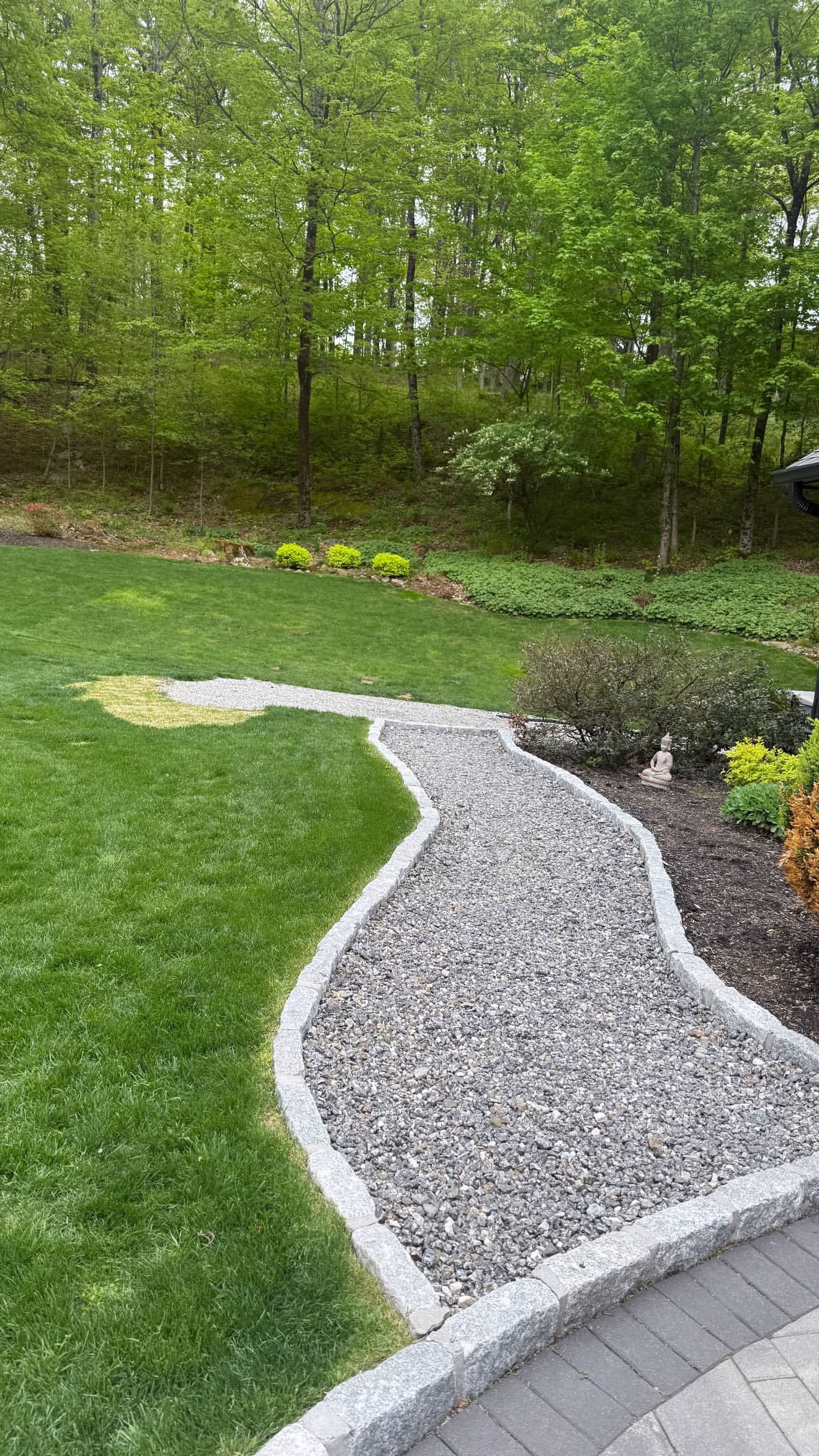 River-rock walkway with granite edge