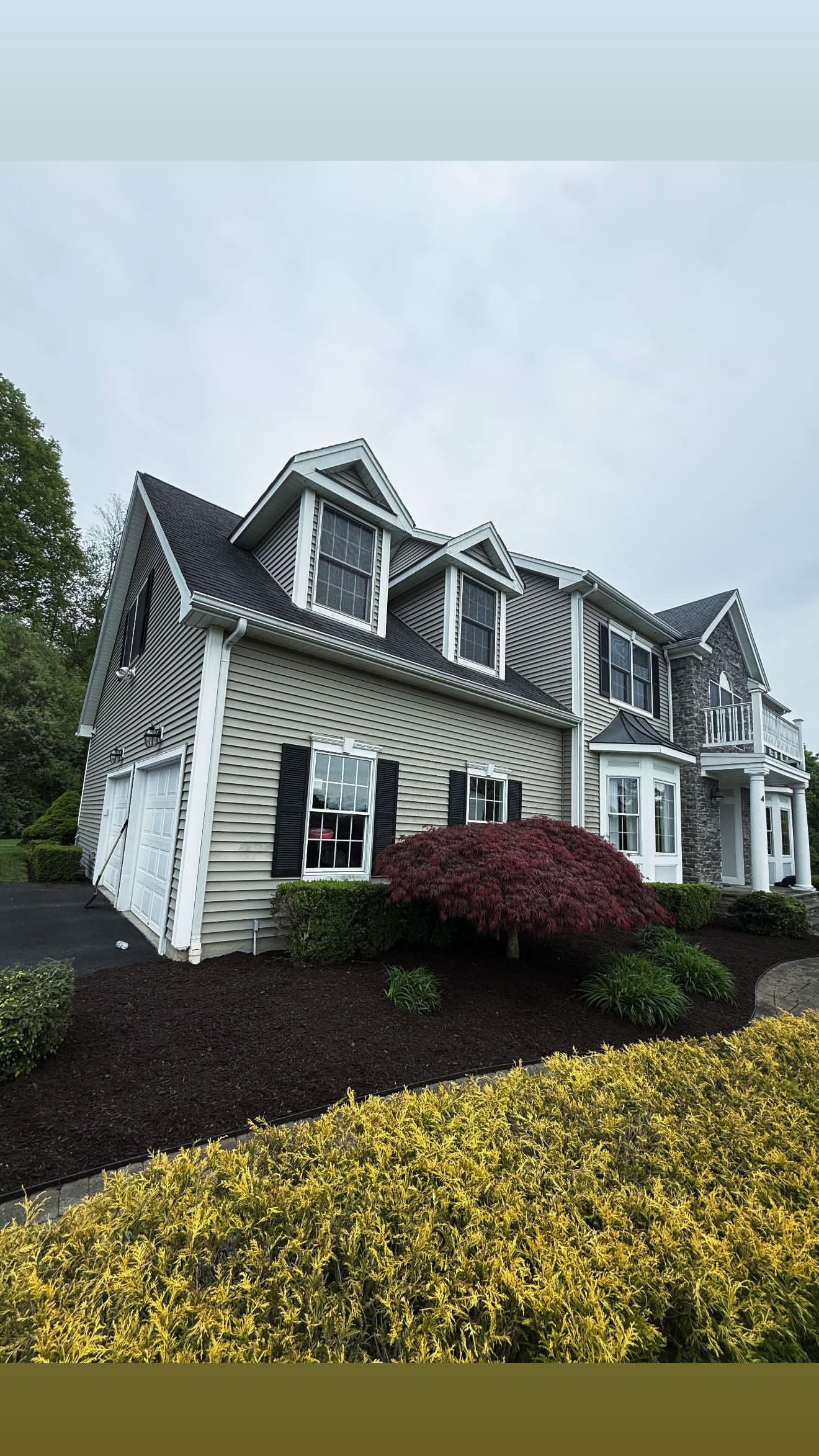 Full foundation planting, colonial home